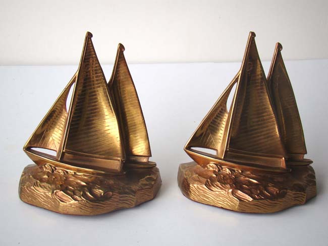 An attractive pair of solid brass racing Sail Boat Bookends by Philadelphia Mfg. Co. circa 1935-1940